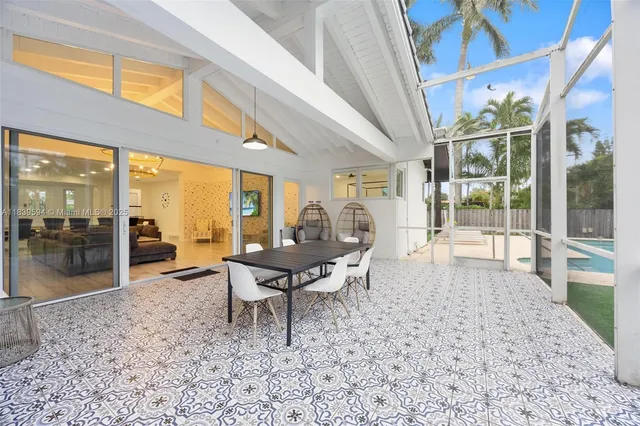 a kitchen with a sink and white cabinets