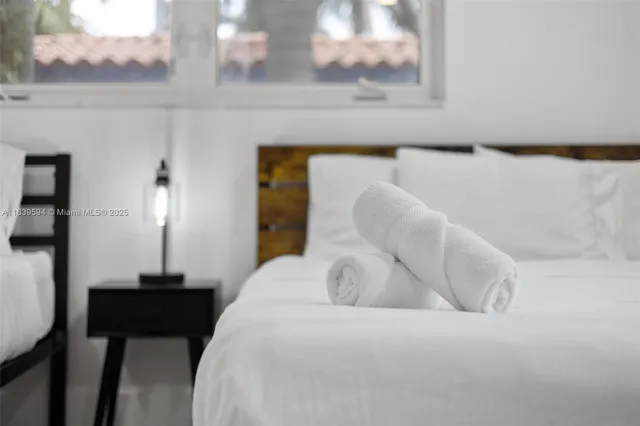 an aerial view of residential houses with outdoor space and street view