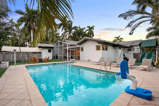 a view of a patio with a table chairs and a table