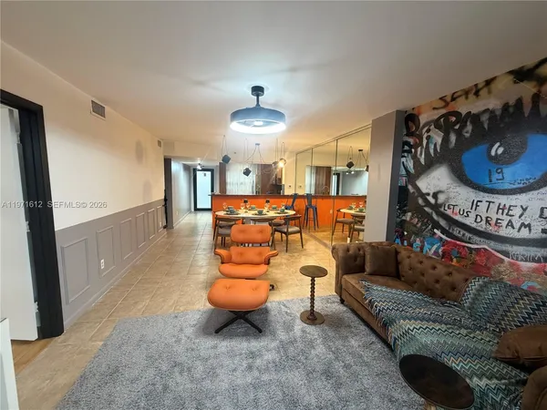 a living room with furniture and a rug