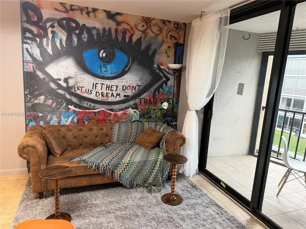 a living room with furniture and a window
