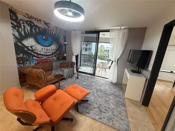 a view of a balcony with a table and chairs