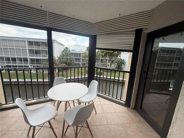 a view of a room with furniture and a window