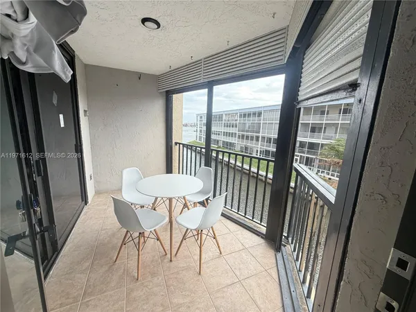 a view of a balcony with an outdoor space