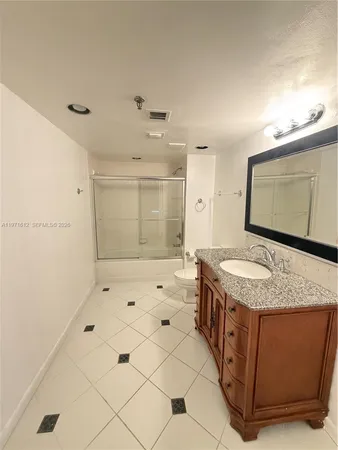 a bedroom with a bed and a walk in closet