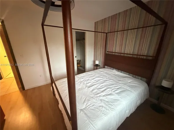 a living room with furniture and a mirror