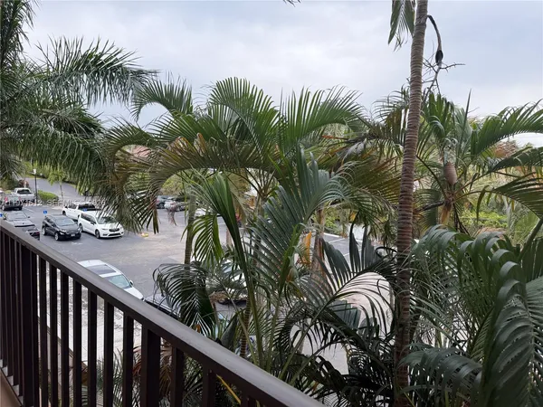 a room with furniture pool table and windows