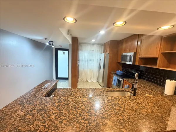 a view of a hallway with seating area