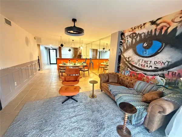 a living room with furniture and a rug