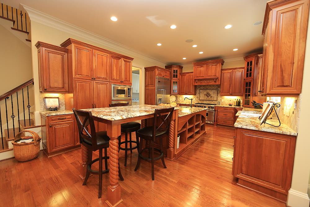 1809 Silver Mist Court Raleigh, NC 27613 - Photo 16 of 30 Large kitchen with lots of cabinets, big island, disposal w/ foot switch. Tons of custom slide out drawers in lower cabinets. Kitchen