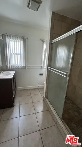 a kitchen with a refrigerator a sink