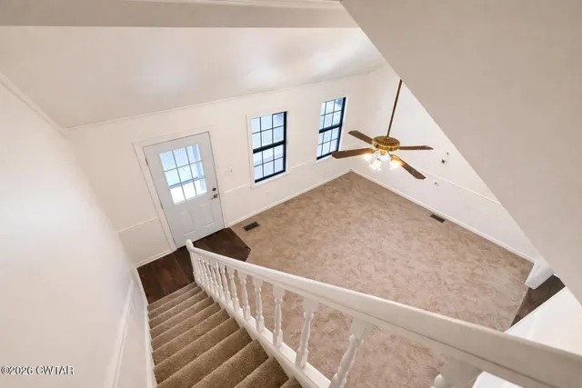 a view of a hallway with windows