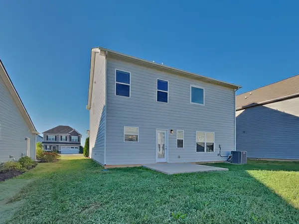a house view with a backyard space