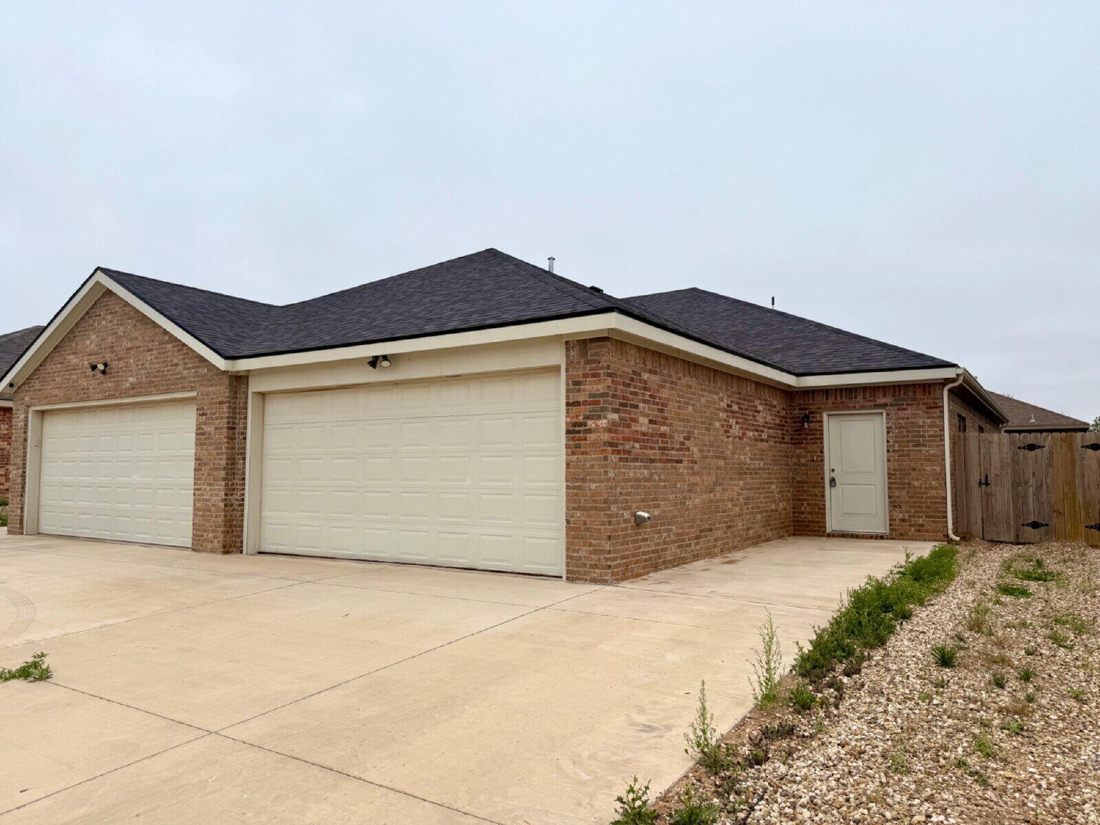 a front view of a house with a garage