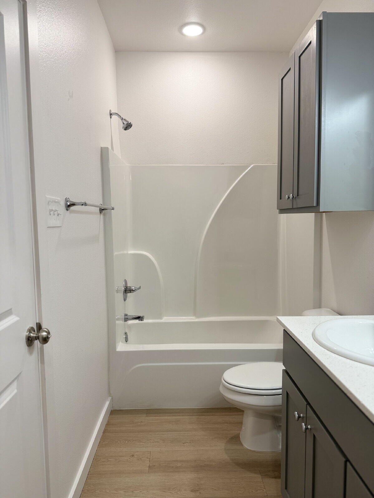 5703 Kemper Street, Unit 2 Lubbock, TX 79416 - Photo 17 of 26 a bathroom with a toilet a sink and bathtub