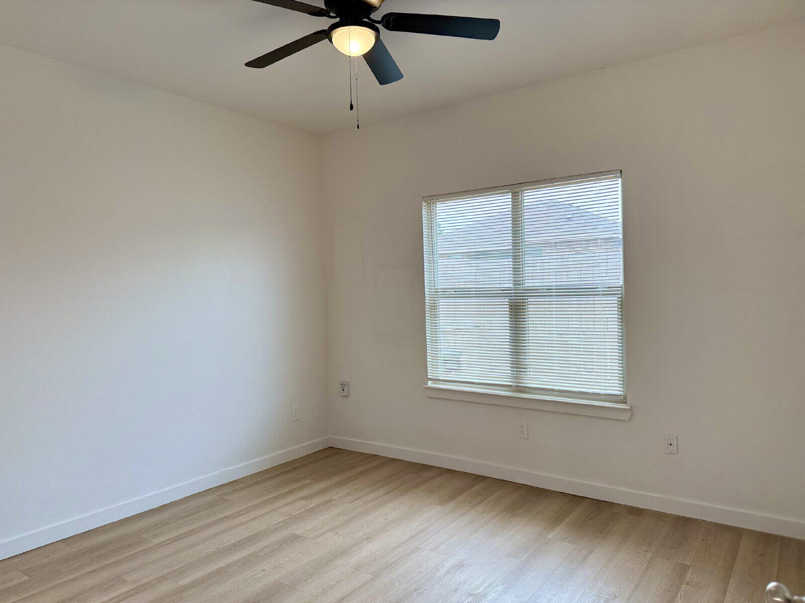 5703 Kemper Street, Unit 2 Lubbock, TX 79416 - Photo 19 of 26 an empty room with a window