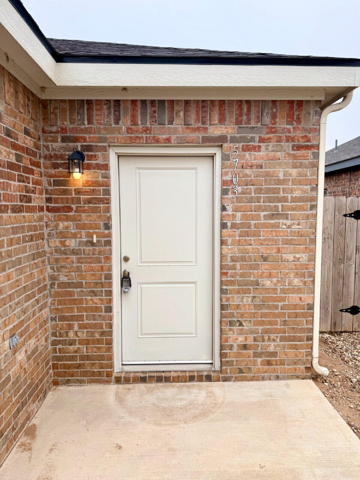 5703 Kemper Street, Unit 2 Lubbock, TX 79416 - Photo 2 of 26 a view of entrance gate of building