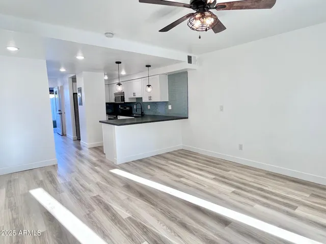 a view of a kitchen with a sink and dishwasher