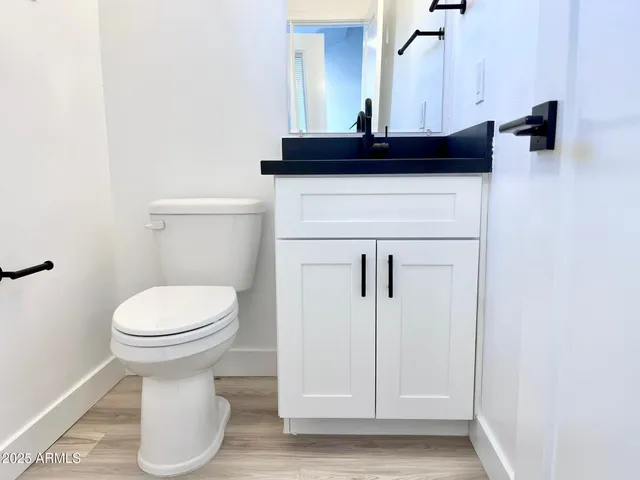 a view of bathroom with a sink and a toilet