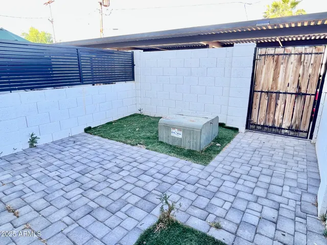 a couple of potted plants in front of door