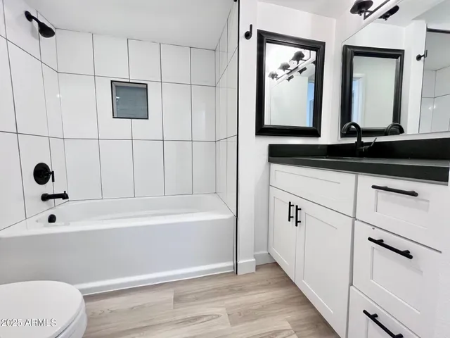 a bathroom with a bathtub and a sink