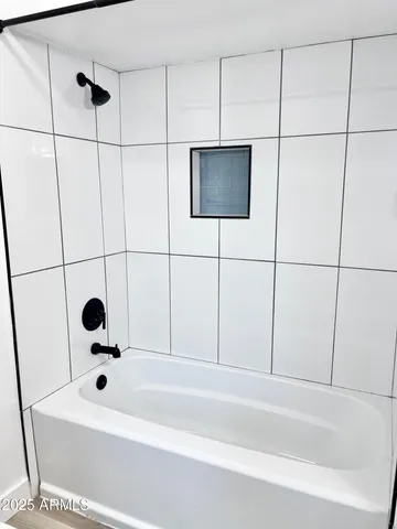 a bathroom with a sink a toilet a shower and a mirror