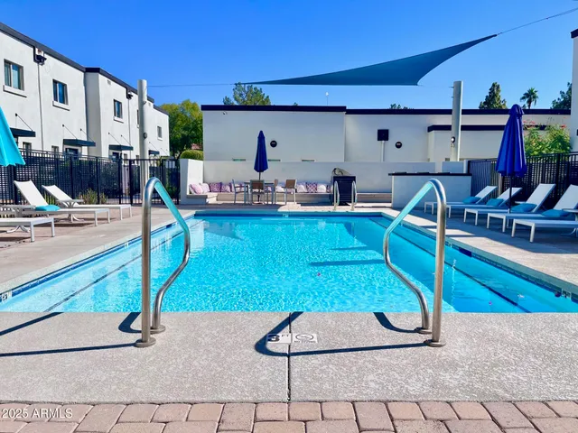 a kitchen with stainless steel appliances kitchen island granite countertop a sink and cabinets