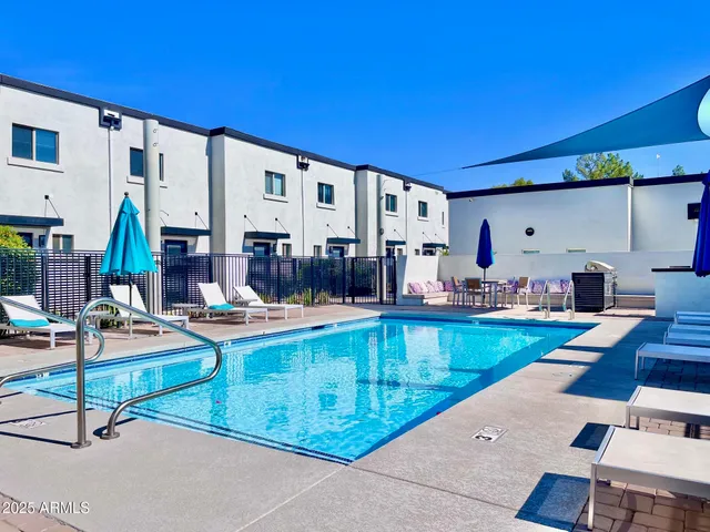 swimming pool with outdoor seating and yard