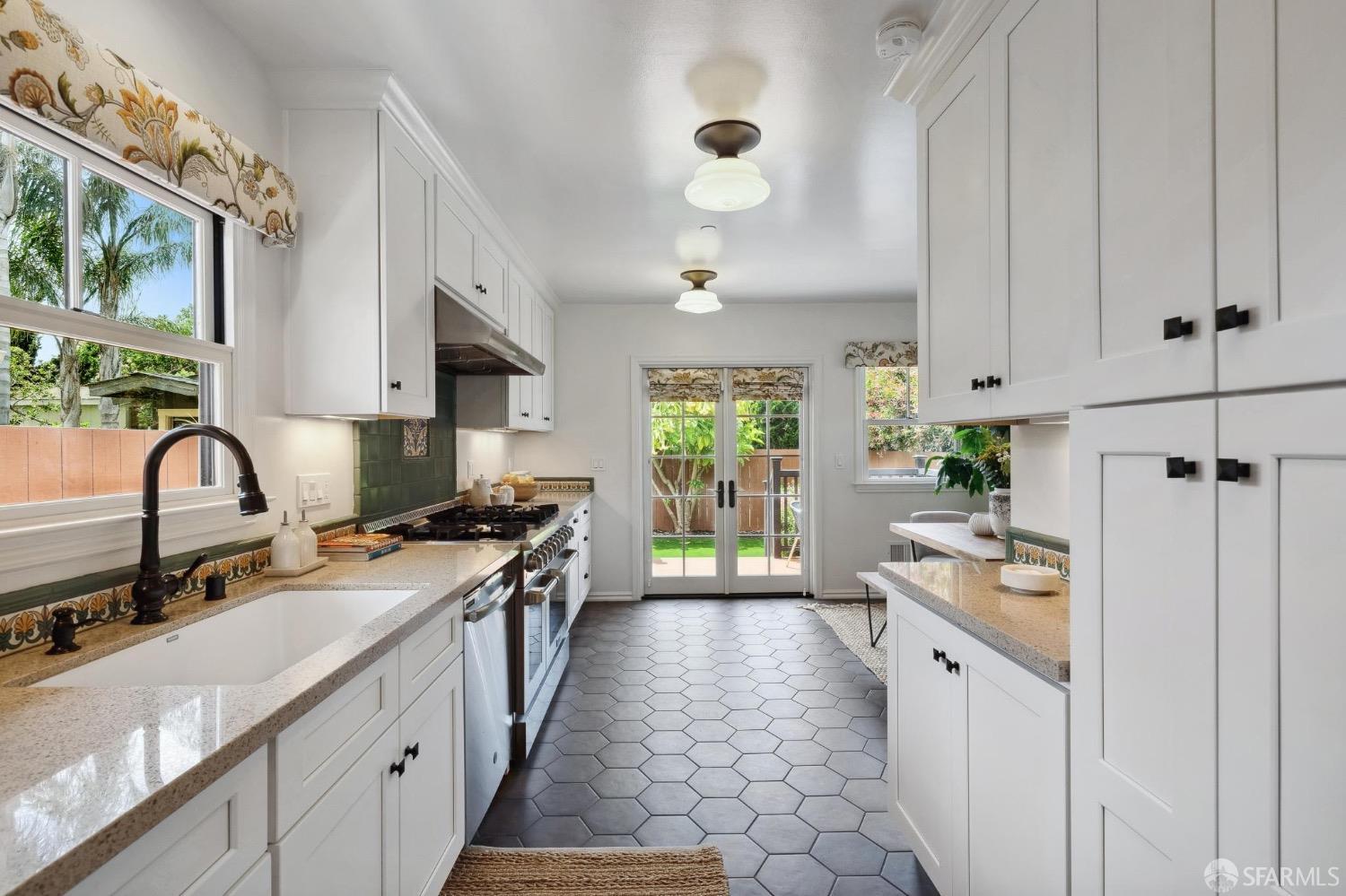 508 Talbot Avenue Albany, CA 94706 - Photo 13 of 66 a kitchen with stainless steel appliances granite countertop a sink stove and refrigerator