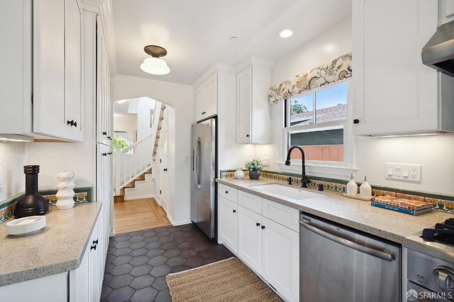 508 Talbot Avenue Albany, CA 94706 - Photo 15 of 66 a kitchen with stainless steel appliances granite countertop a sink stove and refrigerator
