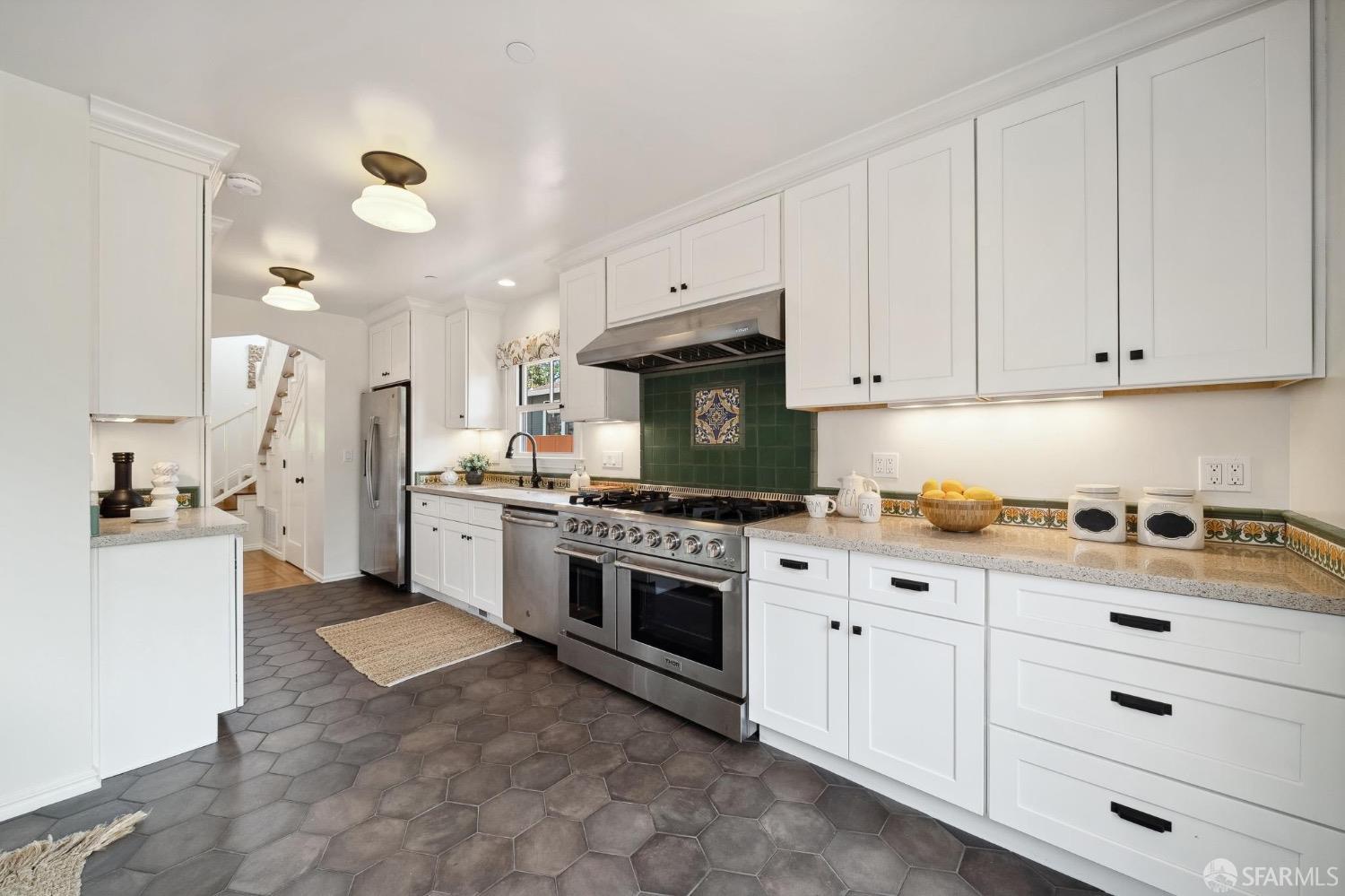 508 Talbot Avenue Albany, CA 94706 - Photo 17 of 66 a kitchen with granite countertop a stove oven and a white cabinets