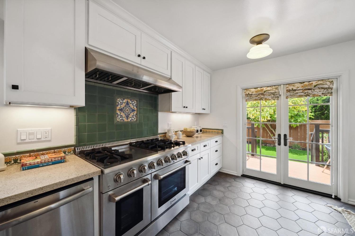 508 Talbot Avenue Albany, CA 94706 - Photo 21 of 66 a kitchen with granite countertop a stove and a sink