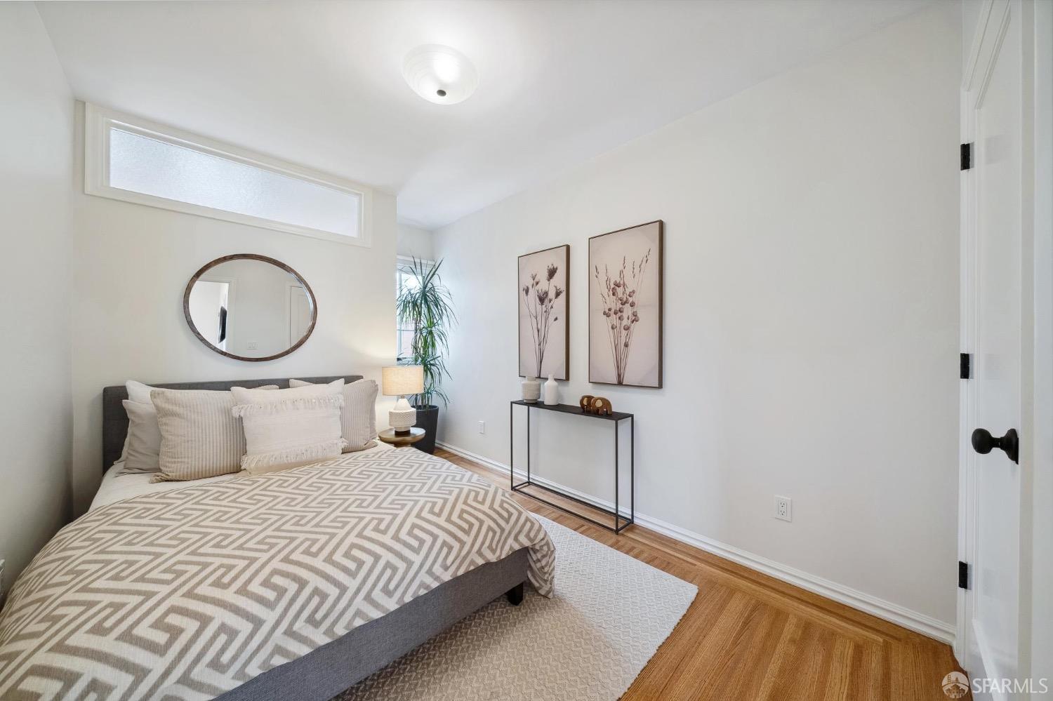 508 Talbot Avenue Albany, CA 94706 - Photo 30 of 66 a bedroom with a bed and a chandelier