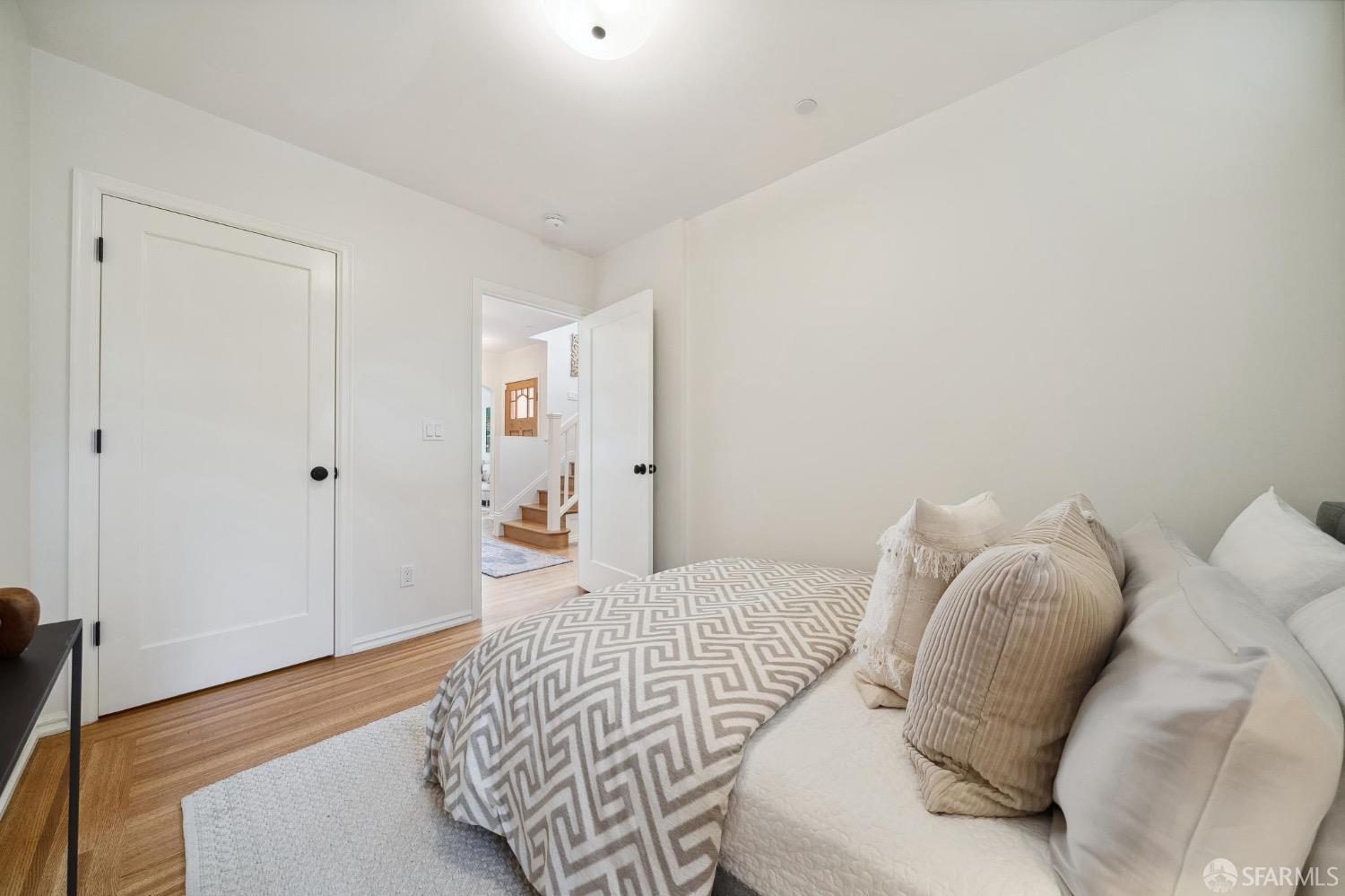 508 Talbot Avenue Albany, CA 94706 - Photo 32 of 66 a bedroom with a bed and wooden floor