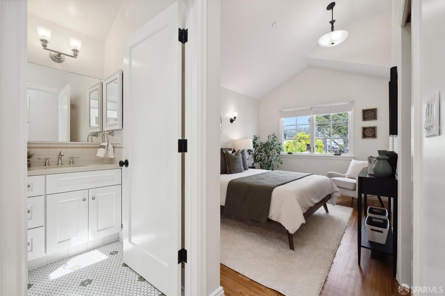 508 Talbot Avenue Albany, CA 94706 - Photo 38 of 66 a en suite bathroom with a double vanity sink a mirror a bathtub and a shower