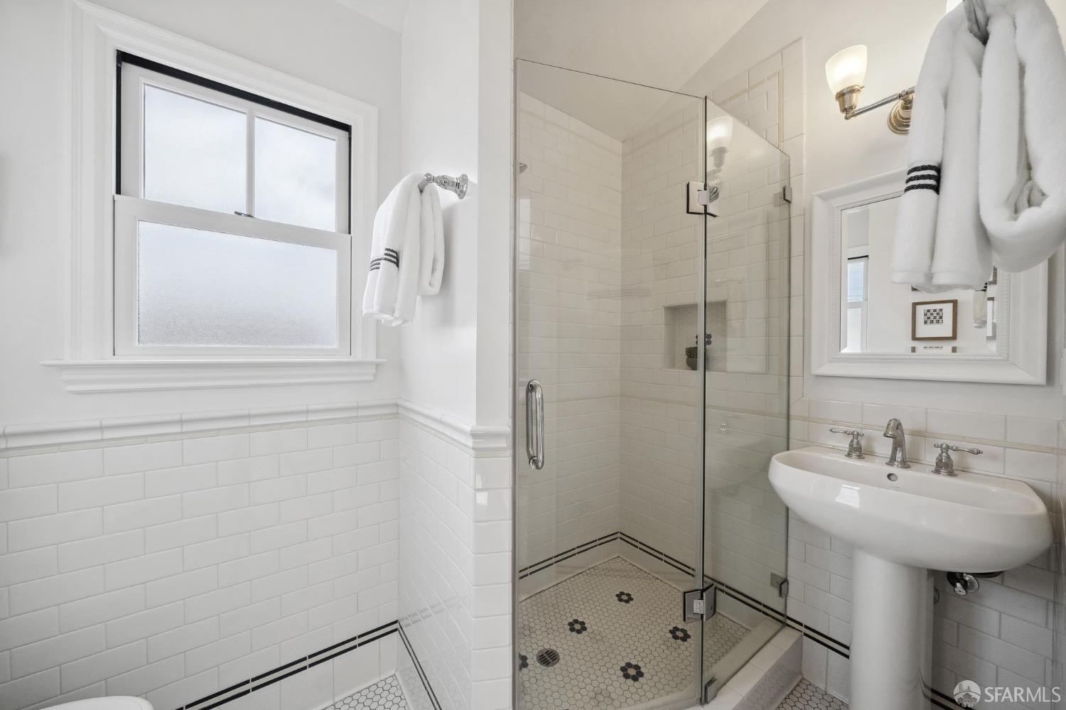 508 Talbot Avenue Albany, CA 94706 - Photo 51 of 66 a bathroom with a sink a mirror and a shower