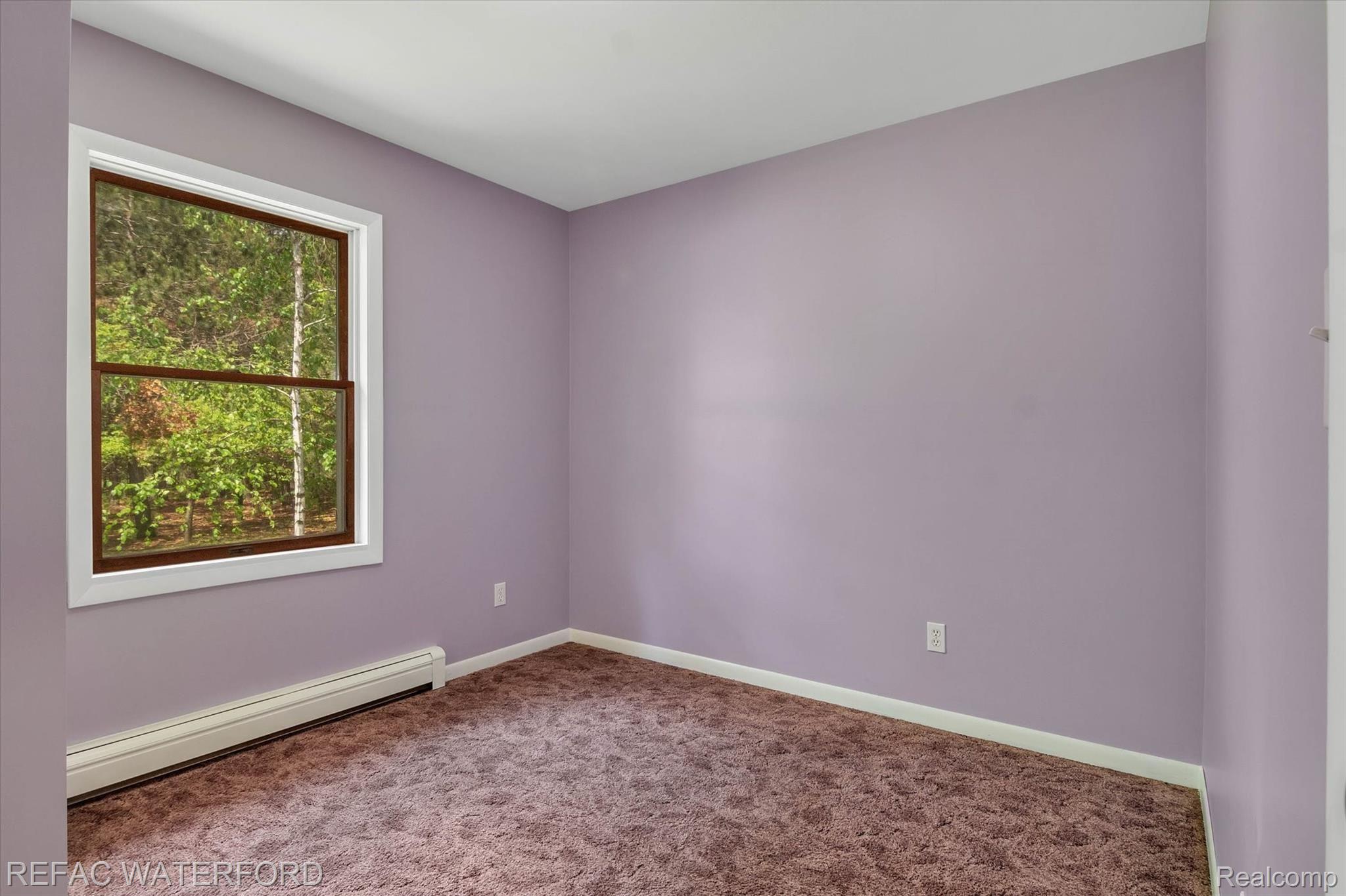 480 Roscommon Road Roscommon, MI 48653 - Photo 24 of 65 Bedroom 3, great light from front of house in this room.