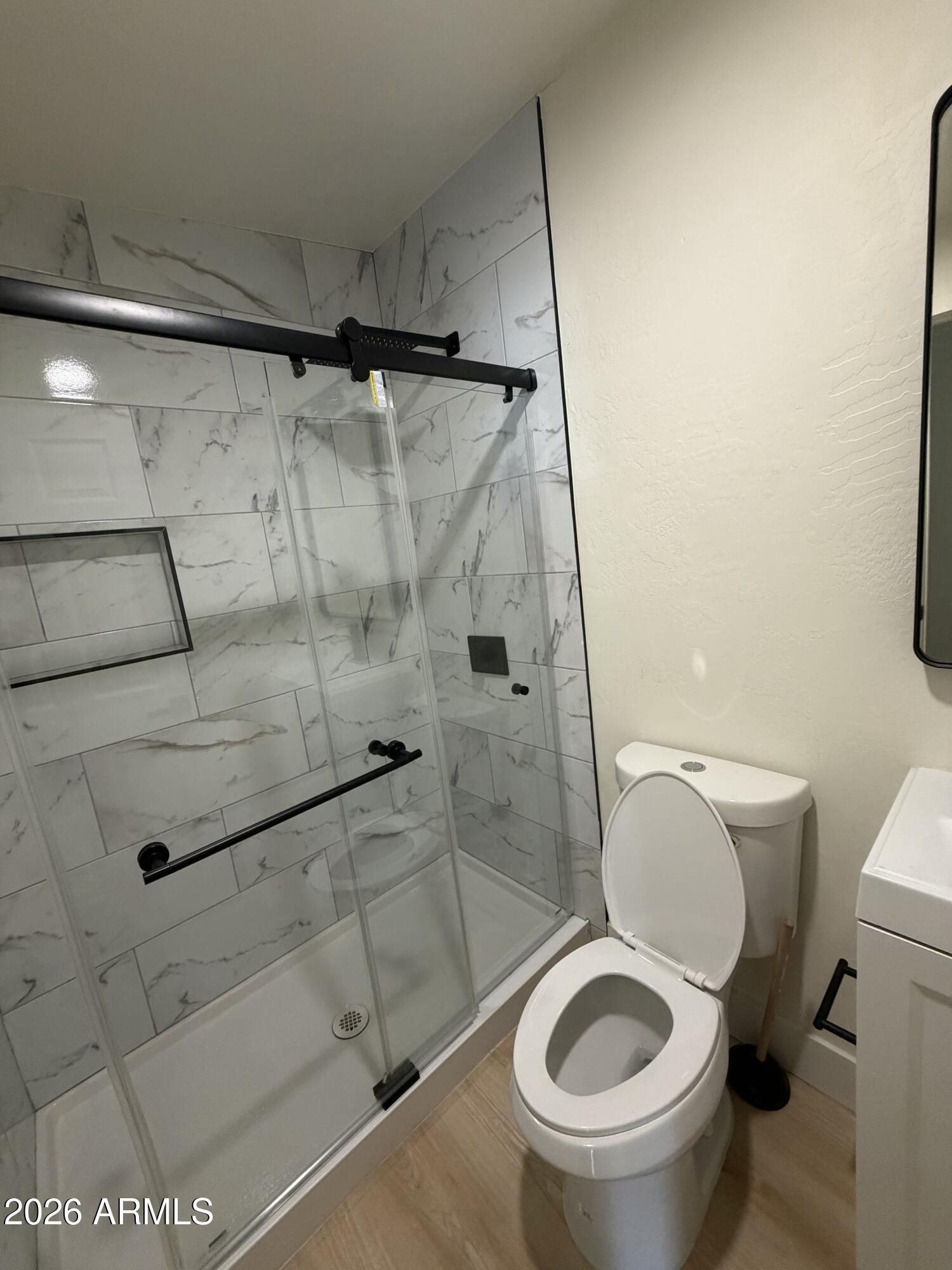 1730 West Thomas Road Phoenix, AZ 85015 - Photo 26 of 38 a bathroom with a toilet and a shower