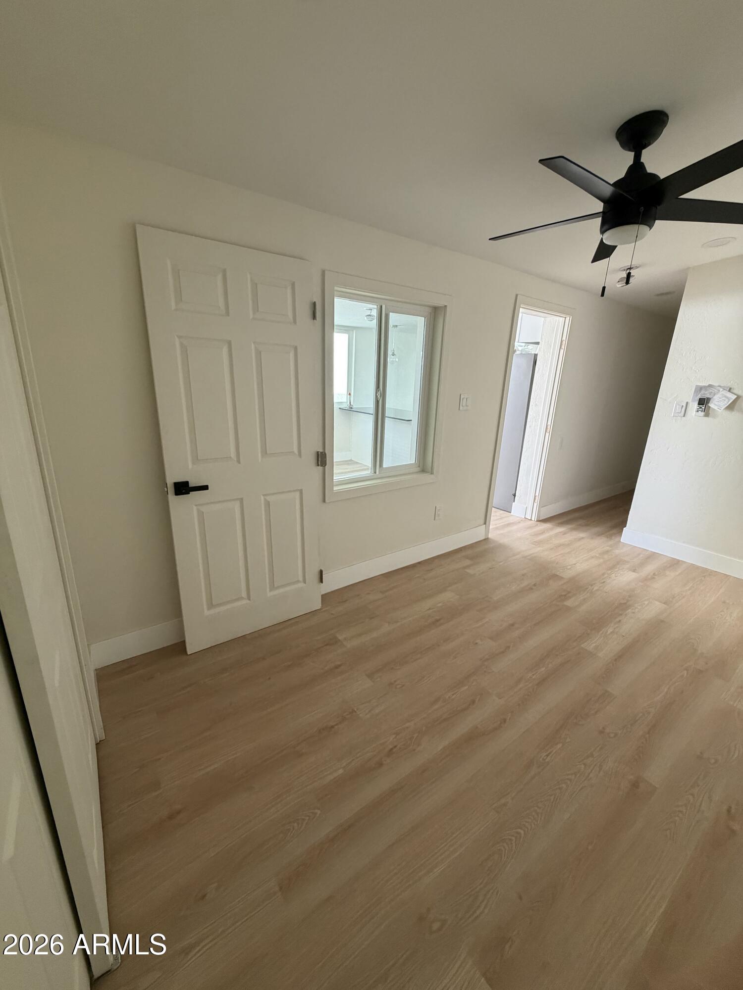 1730 West Thomas Road Phoenix, AZ 85015 - Photo 30 of 38 a view of a big room with wooden floor and windows