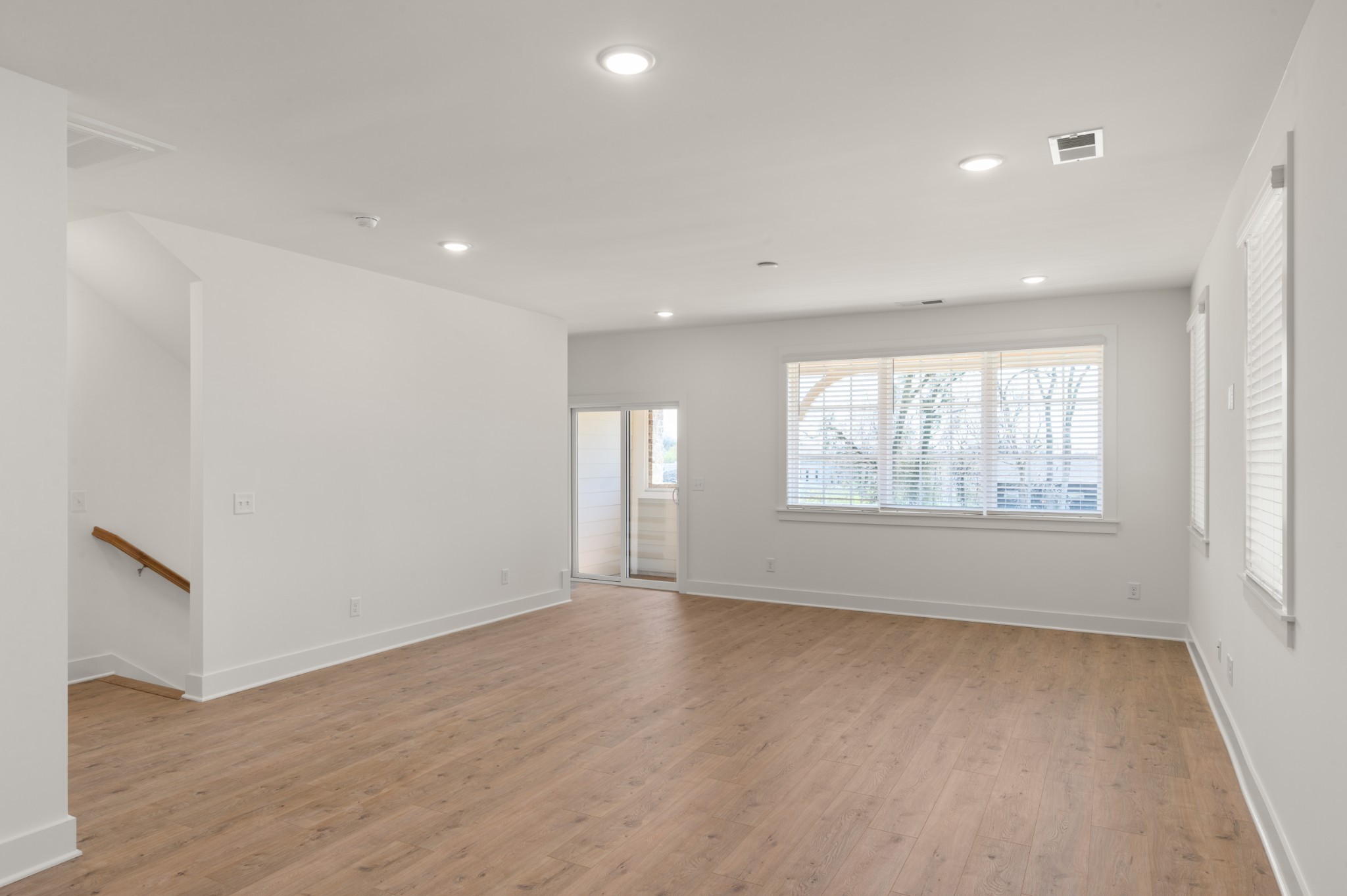 251 Nesbitt Lane Madison, TN 37115 - Photo 6 of 20 a view of an empty room with wooden floor and a window