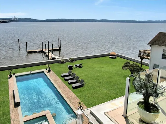 a view of a pool with a patio
