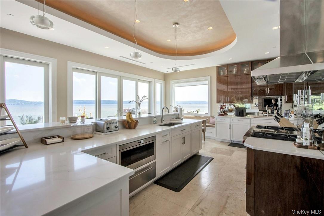 74 River Road Nyack, NY 10960 - Photo 11 of 36 a kitchen with sink stove and cabinets