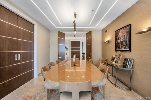 a dining room with furniture and window