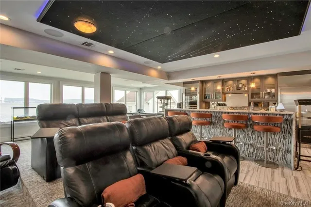 a media room with lots of chairs and a projector screen