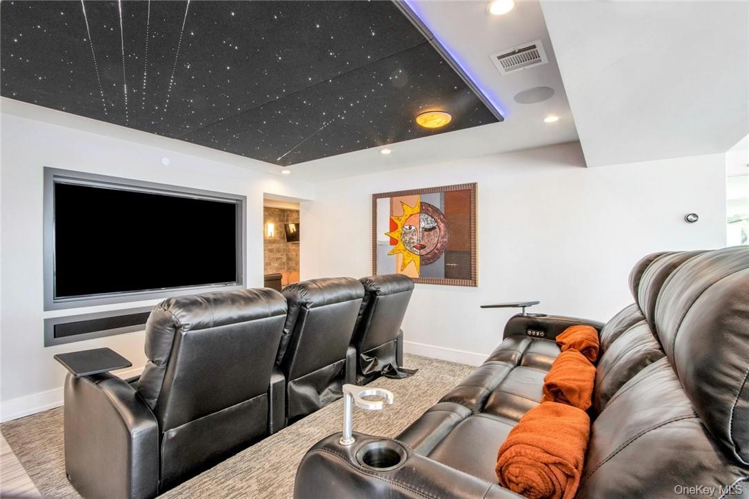 74 River Road Nyack, NY 10960 - Photo 18 of 36 a living room with furniture and a flat screen tv