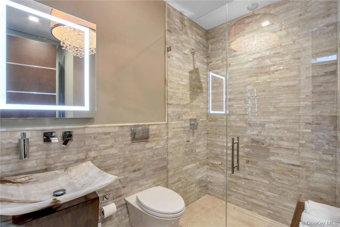 74 River Road Nyack, NY 10960 - Photo 20 of 36 a bathroom with a sink toilet and shower