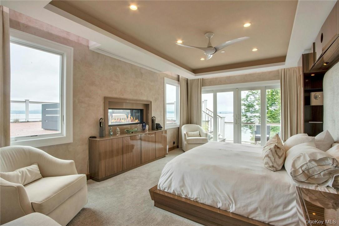 74 River Road Nyack, NY 10960 - Photo 22 of 36 a bedroom with furniture and a large window