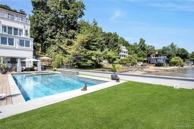 a view of a swimming pool with a patio
