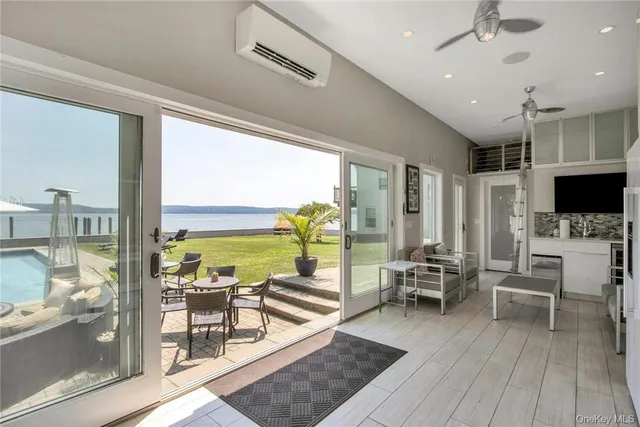 a living room with fireplace furniture and a flat screen tv