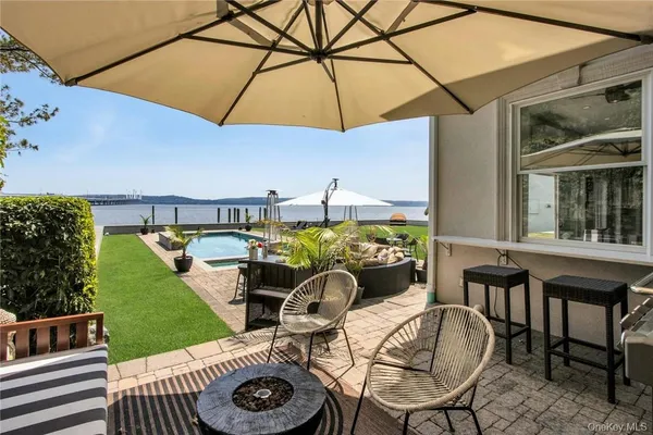 a view of a chair and table in the patio